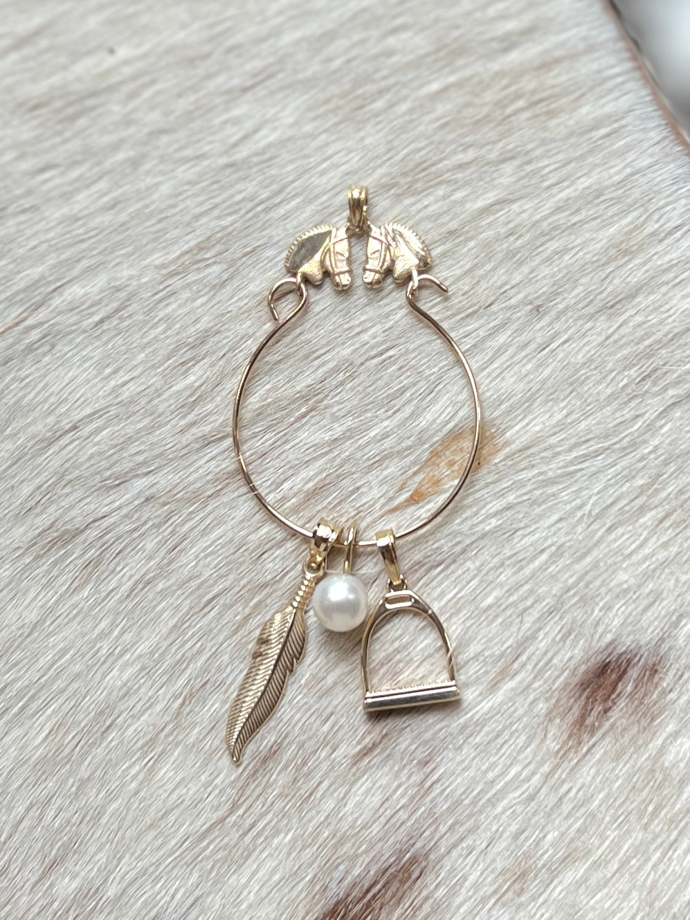 Feather charm